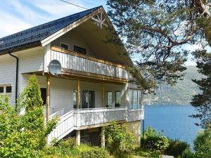 a house with a view of the water at Holiday Home Eliasgården in Folkestad