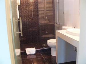 Kylpyhuone majoituspaikassa Hotel Turist