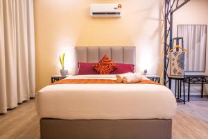 Postel nebo postele na pokoji v ubytování Cinta Abadi Resort
