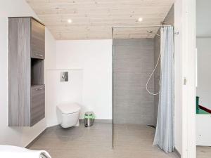 a bathroom with a shower and a toilet in it at 12 person holiday home in Vestervig-By Traum in Vestervig +28 photos
