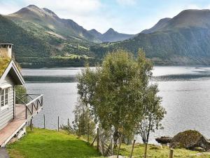 a house with a view of a lake and mountains at 11 person holiday home in Lauvstad in Åmelfot