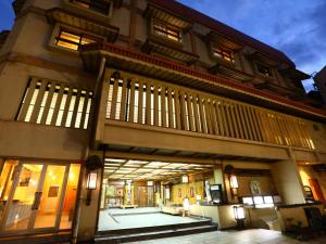 a large building with a courtyard in front of it at Tokiwaya in Nozawa Onsen