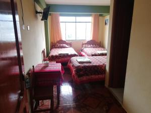Postel nebo postele na pokoji v ubytování Artesonraju Hostel Huaraz