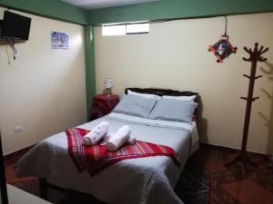 Postel nebo postele na pokoji v ubytování Artesonraju Hostel Huaraz