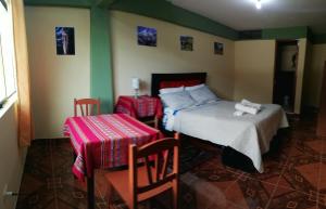 Postel nebo postele na pokoji v ubytování Artesonraju Hostel Huaraz