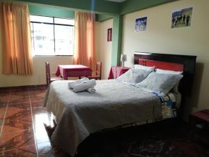 Postel nebo postele na pokoji v ubytování Artesonraju Hostel Huaraz