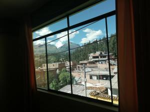 Nespecifikovaný výhled na hory nebo výhled na hory při pohledu z hostelu