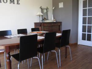 a dining room with a wooden table and chairs at Holiday Home in Bouillon in Bouillon