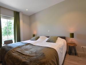 Voodi või voodid majutusasutuse Tasteful holiday home in Sijsele Brugge with garden toas