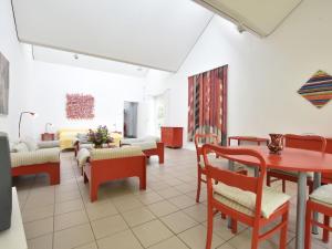 a living room with a table and chairs at Ferienhaus Ostseeblick in Kühlungsborn in Kühlungsborn