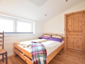 Ein Bett oder Betten in einem Zimmer der Unterkunft Modern Apartment in Pugholz with Terrace