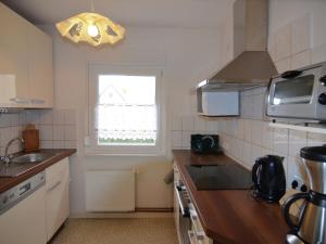 a kitchen with a sink and a window at Quaint Holiday Home in Schmogrow Fehrow in Schmogrow