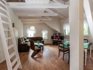 a living room with a couch and a table at Ruhige Ferienwohnung mit Parkplatz in Thale in Thale +32 photos