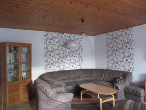 a living room with a couch and a table at Attractive Holiday Home in Rotenburg with Garden in Dankerode