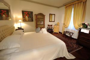 Postel nebo postele na pokoji v ubytování Hotel Villa Beccaris