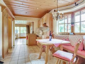 a living room with a table and a couch at Apartment in Ruhpolding with Alps view in Ruhpolding