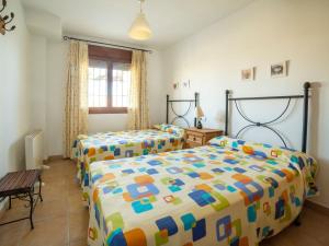 A bed or beds in a room at Apartment in Palomares near the Beach