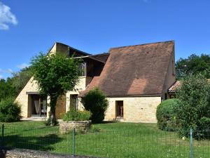 an old brick house with a brown roof at Gorgeous Villa in St Julien De Lampon with Private Pool Centre Nearby in Carlux