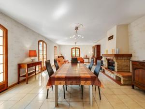 a dining room with a table and chairs at Beautiful villa with private garden in Pineuilh in Pineuilh