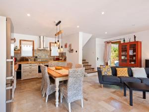 a kitchen and living room with a table and chairs at VIlla in Bargemon with Private Swimming Pool in Bargemon