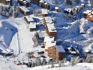 an aerial view of a ski resort in the snow at South facing flat with balcony in Méribel