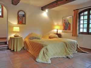 a bedroom with a bed and two lamps at Charming Villa in Callas with Private Swimming Pool in Callas