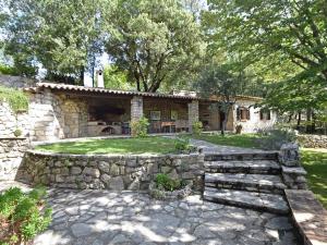 a stone house with a stone wall at Charming Villa in Callas with Private Swimming Pool in Callas