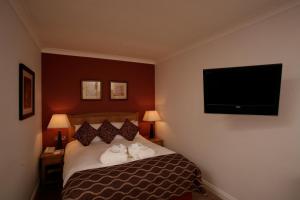 A bed or beds in a room at Cisswood House 