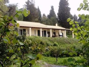 a house in the middle of a garden at Holiday home with stunning views near Afionas in Afionas