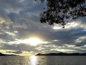 a sunset over a large body of water at Attractive apartment in Dubrovni with balcony in Lopud