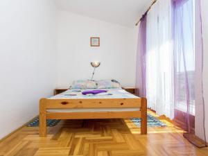 Ein Bett oder Betten in einem Zimmer der Unterkunft Apartment in Šilo near the Sea