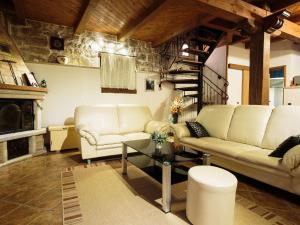 a living room with a couch and a staircase at Cosy holiday home in Vrsar with private pool in Marasi