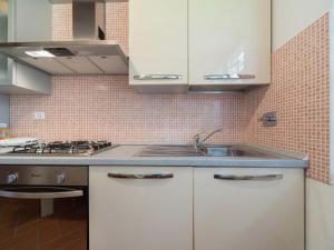 A kitchen or kitchenette at Holiday Home Rosignano near the Sea