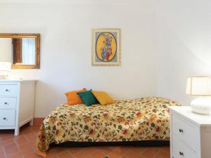 A bed or beds in a room at Holiday Home Rosignano near the Sea