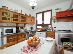 A kitchen or kitchenette at Holiday Home in Vezzi Portio with Pool