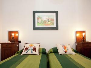 A bed or beds in a room at Holiday Home in Vezzi Portio with Pool