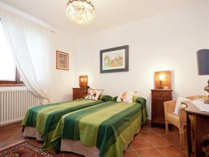A bed or beds in a room at Holiday Home in Vezzi Portio with Pool