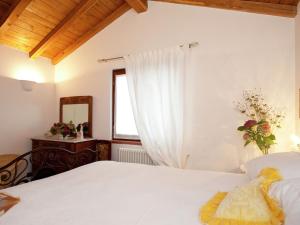 A bed or beds in a room at Holiday Home in Vezzi Portio with Pool