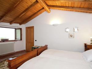A bed or beds in a room at Holiday Home in Vezzi Portio with Pool