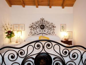 A bed or beds in a room at Holiday Home in Vezzi Portio with Pool