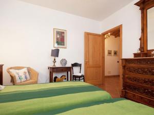 A bed or beds in a room at Holiday Home in Vezzi Portio with Pool