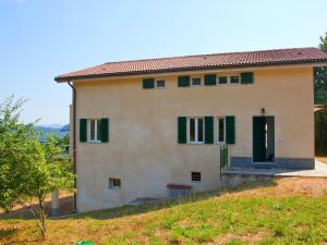 a house on the side of a hill at Stunning Cottage in Sesta Godano with Balcony in Sesta Godano