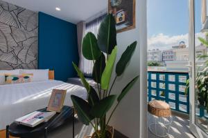 Postel nebo postele na pokoji v ubytování Shoho Hotel Nha Trang + 37 fotografií