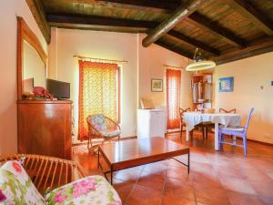 a living room with a table and a dining room at Belvilla by OYO Casa Reale Quattro in Valdamonte