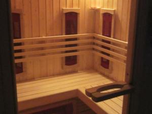 a sauna with wooden racks in a room at Modern Villa in Zwardon with Sauna in Zwardoń