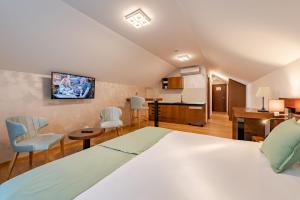 Rubicon Garni Hotel客房内的一张或多张床位