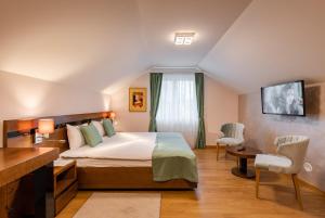 Rubicon Garni Hotel客房内的一张或多张床位