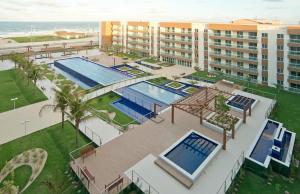 an aerial view of a resort with two swimming pools at Sun Residence in Fortaleza