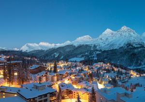 a town in the snow with mountains in the background at Arosa Mountain Lodge in Arosa +23 photos