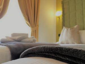 Posteľ alebo postele v izbe v ubytovaní Hotel Nordend
